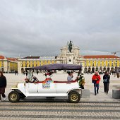 DSC02204 Praça do Comércio. Tuk Tuks waiting to take visitors around the town.